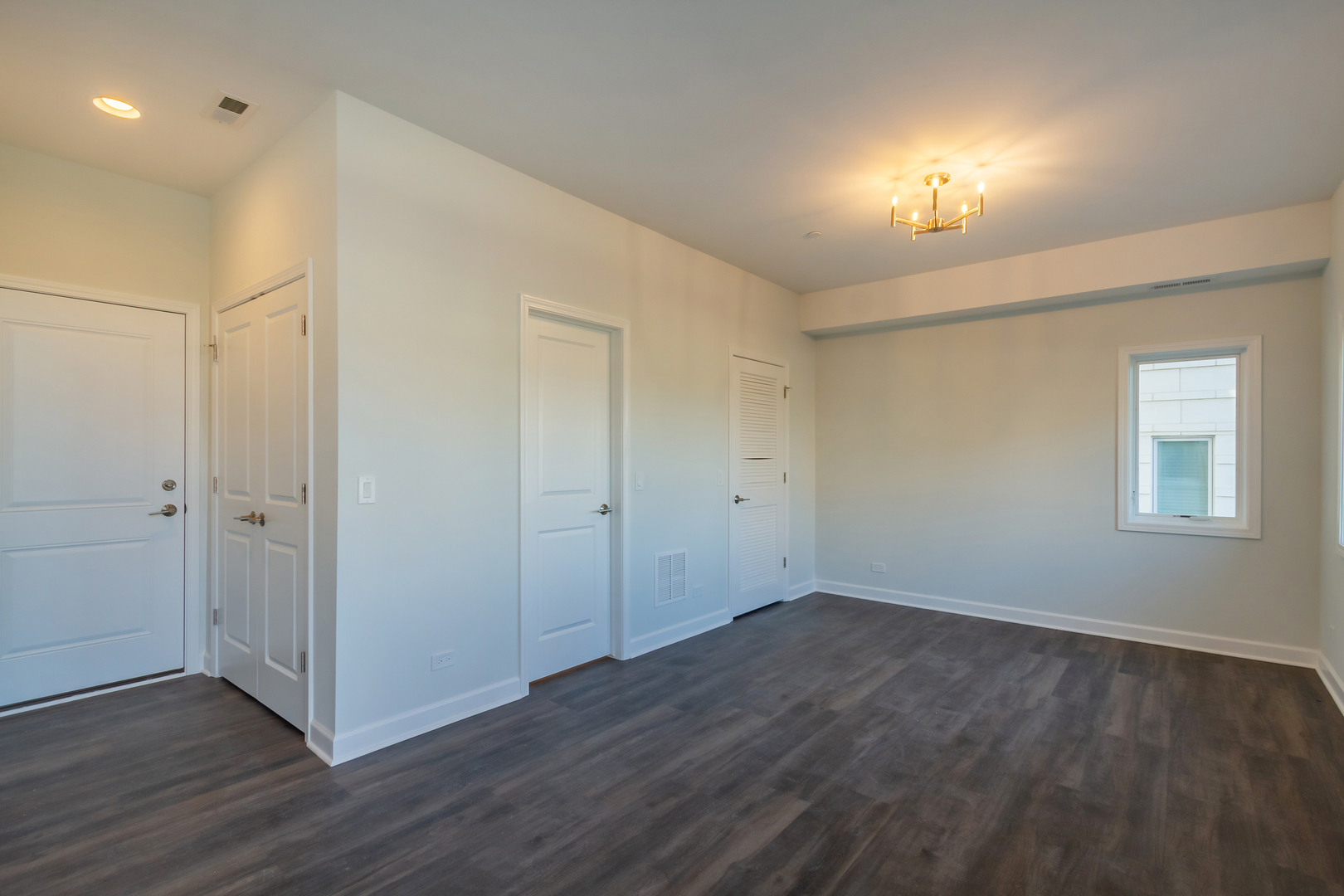 1239 Shermer Road Northbrook, IL 60062 - Photo 20 of 25 a view of an empty room with wooden floor and a window