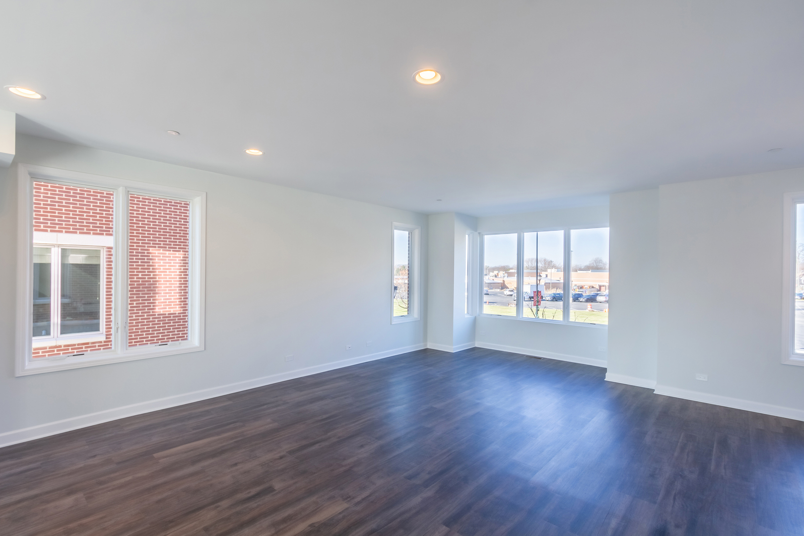 1239 Shermer Road Northbrook, IL 60062 - Photo 4 of 25 a view of an empty room with wooden floor and a window