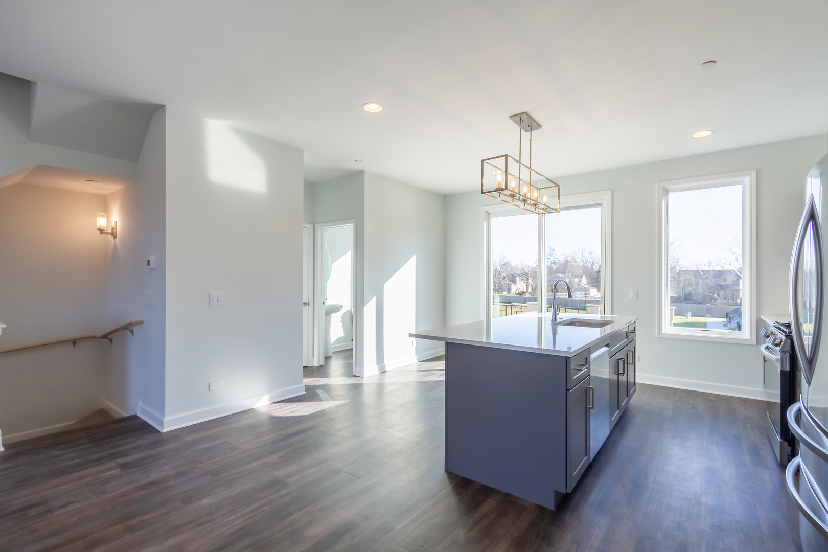 1239 Shermer Road Northbrook, IL 60062 - Photo 7 of 25 a living room with furniture and a chandelier