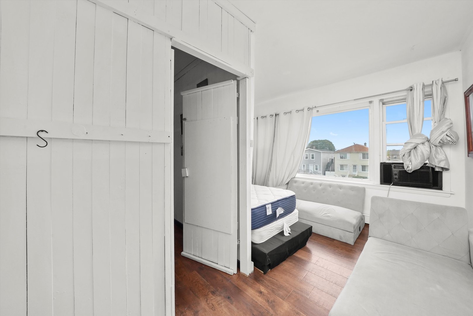 7524 West 63rd Place Summit, IL 60501 - Photo 13 of 44 a view of bedroom with natural light and hardwood floor
