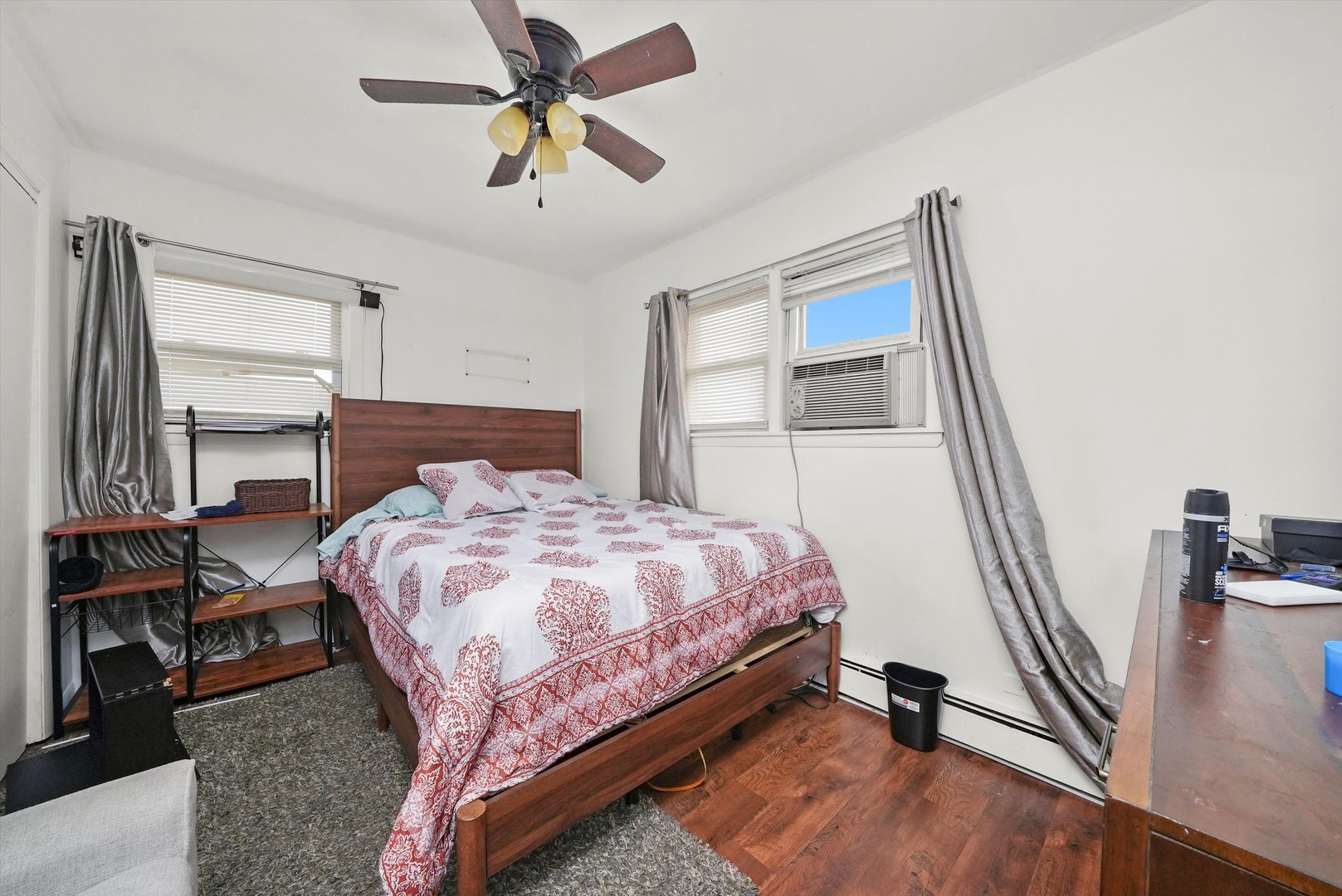 7524 West 63rd Place Summit, IL 60501 - Photo 15 of 44 a bedroom with a bed dresser and a window