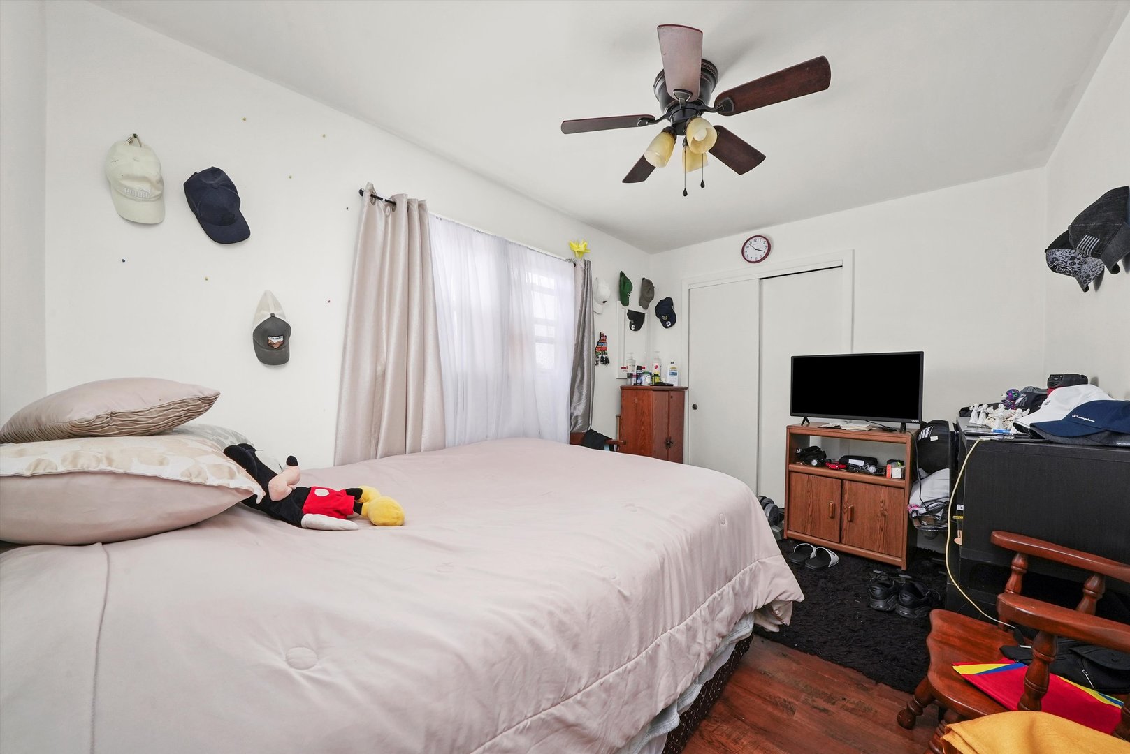 7524 West 63rd Place Summit, IL 60501 - Photo 16 of 44 a bedroom with a bed and a chandelier