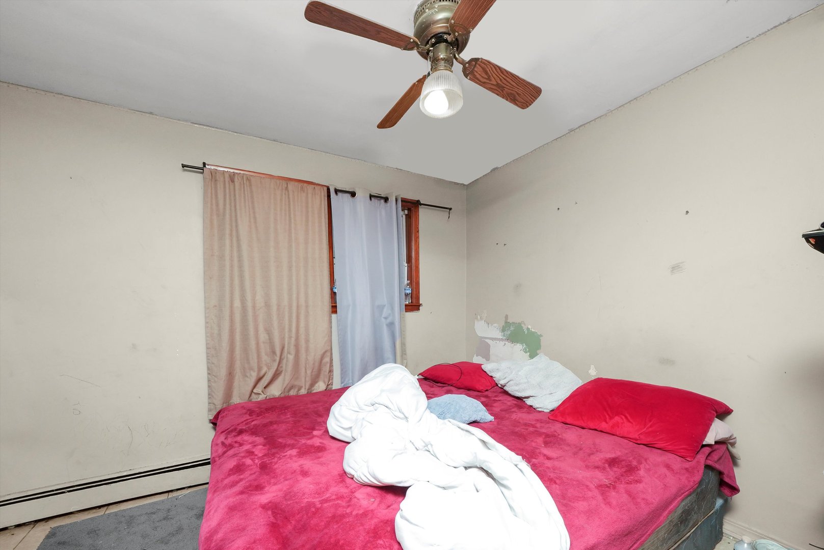 7524 West 63rd Place Summit, IL 60501 - Photo 31 of 44 a bedroom with a bed and a chandelier