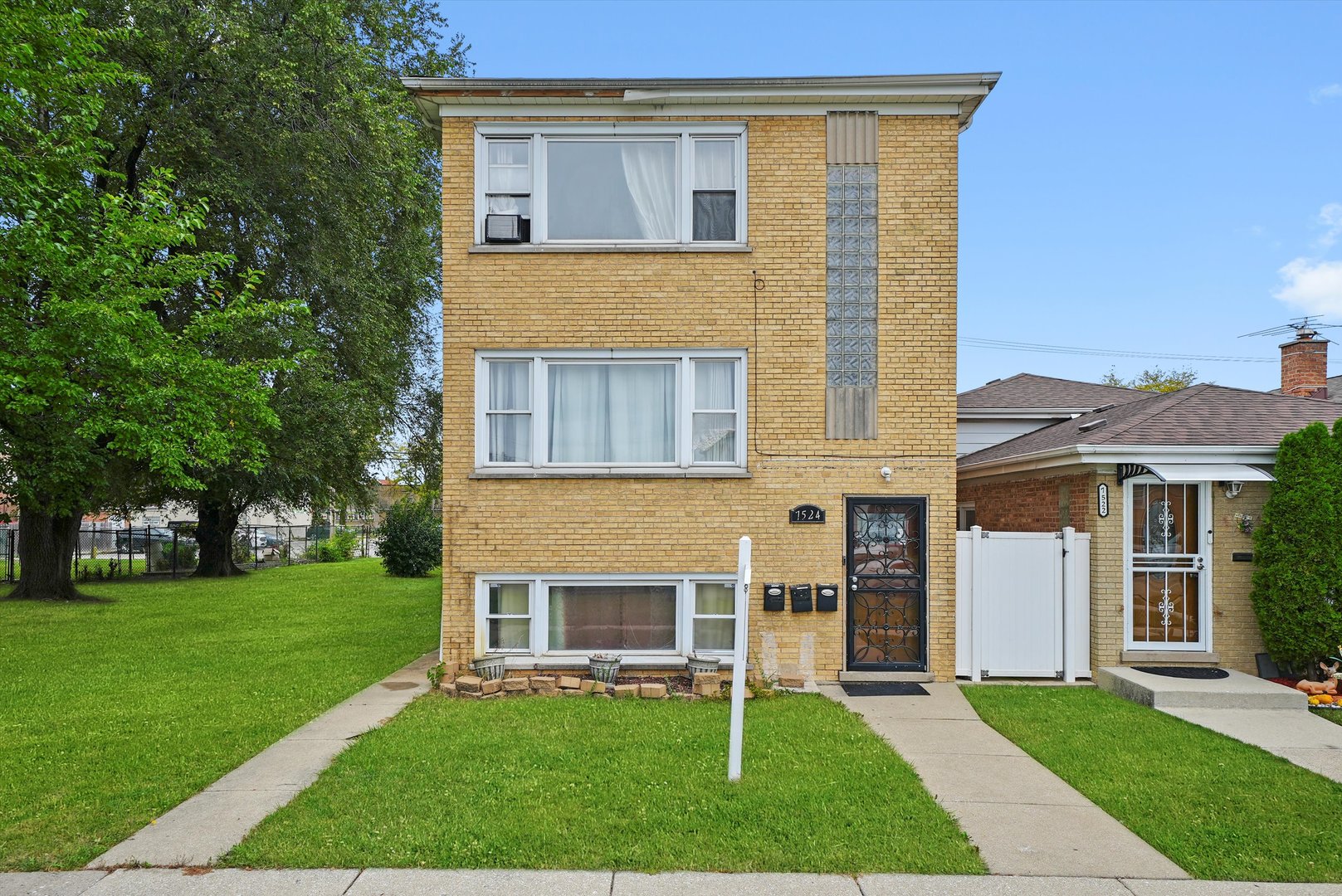 7524 West 63rd Place Summit, IL 60501 - Photo 40 of 44 a front view of a house with a yard