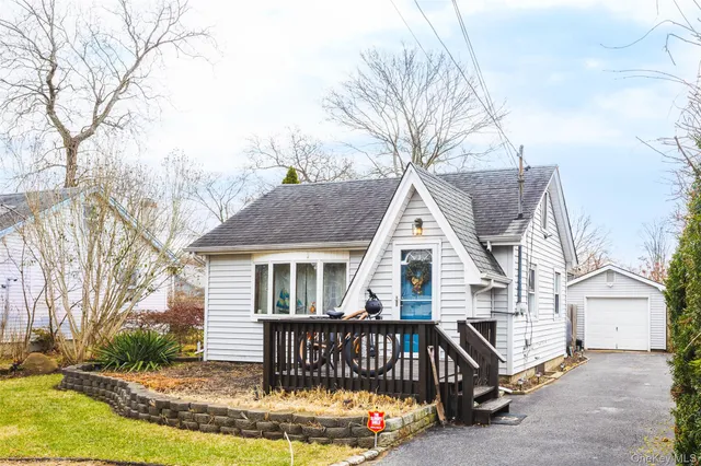 a view of house with a yard outdoor seating and barbeque oven