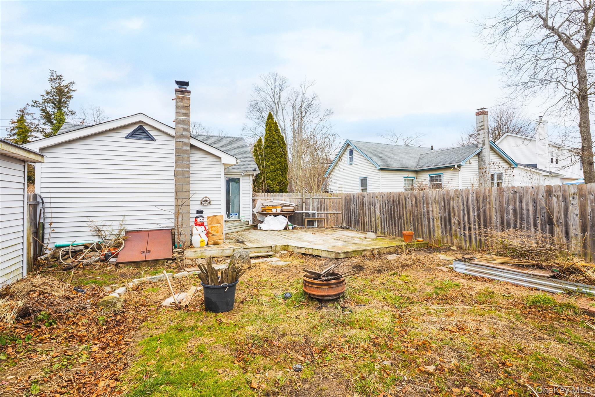 278 Elm Road West Mastic Beach, NY 11951 - Photo 11 of 14 a view of a house with backyard and sitting area