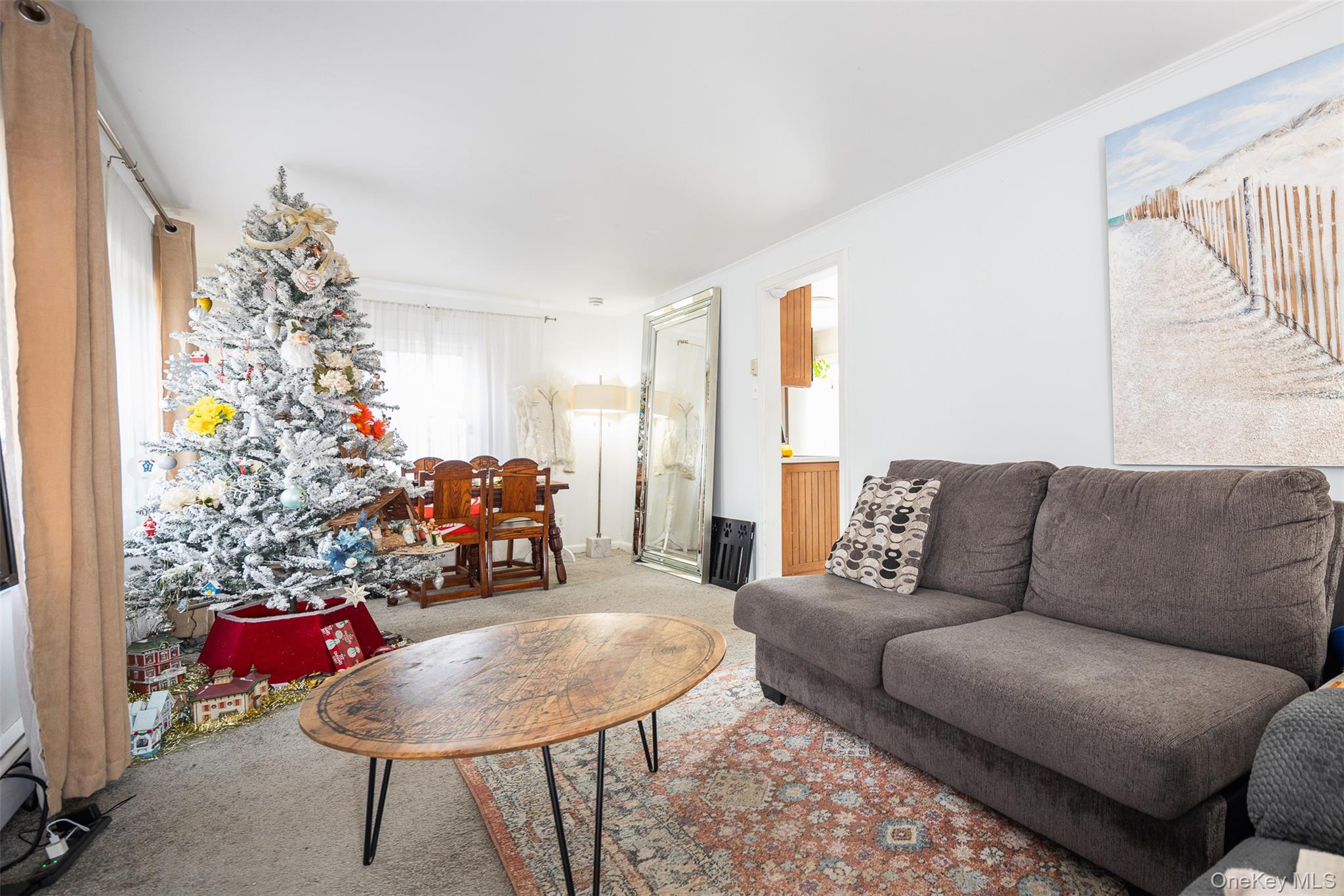 278 Elm Road West Mastic Beach, NY 11951 - Photo 3 of 14 a living room with furniture and a large window