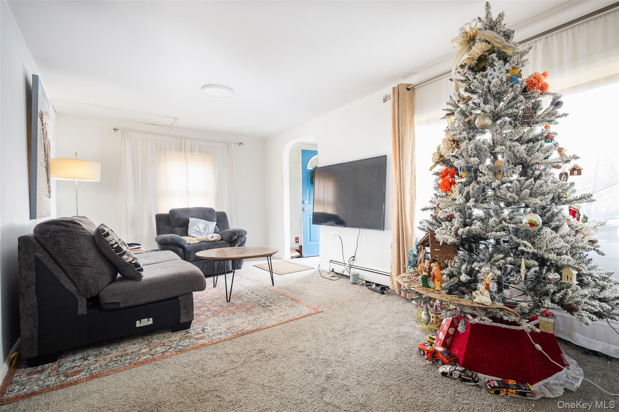 278 Elm Road West Mastic Beach, NY 11951 - Photo 4 of 14 a living room with furniture and a potted plant
