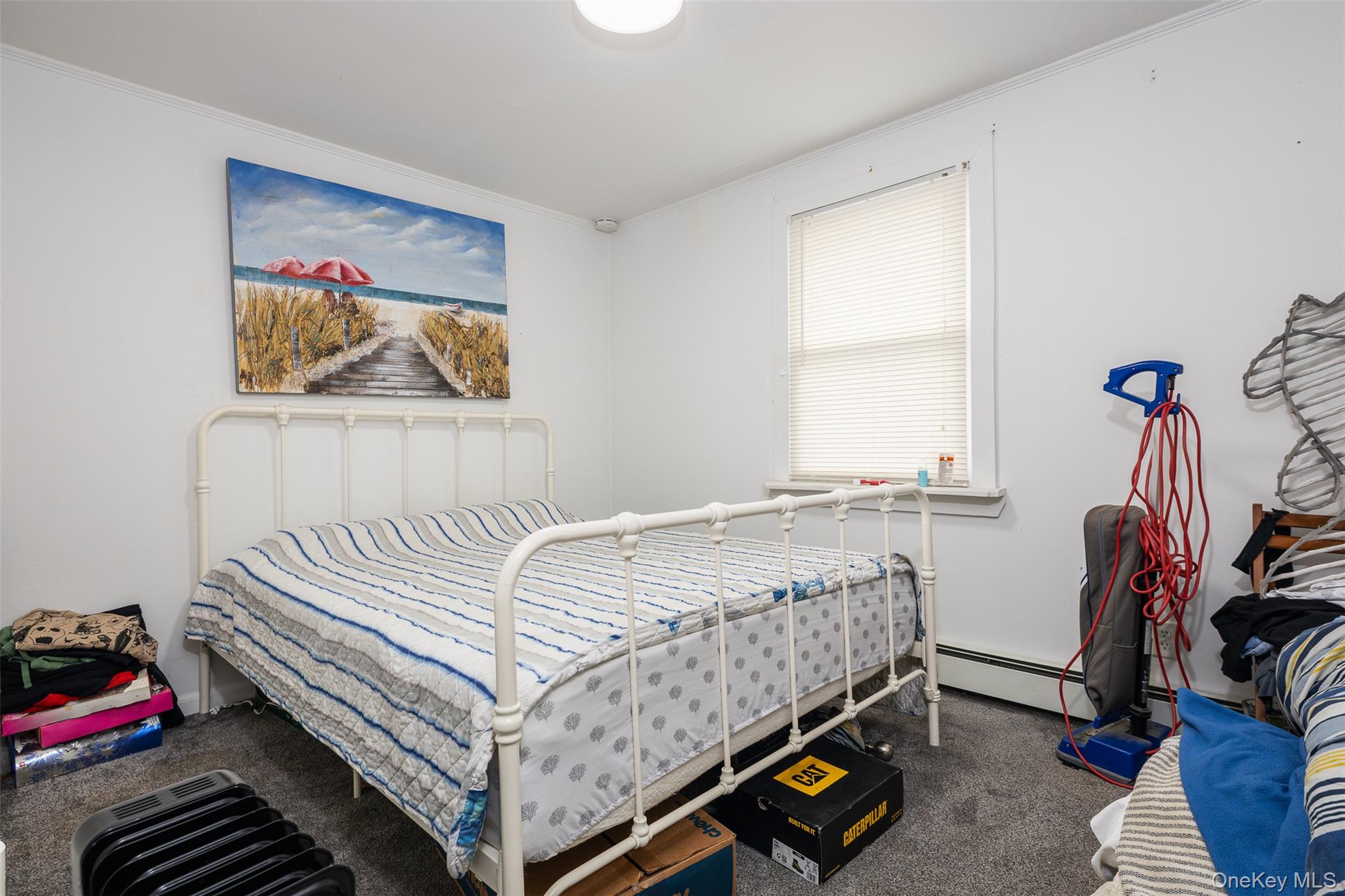 278 Elm Road West Mastic Beach, NY 11951 - Photo 8 of 14 a bedroom with a bed and wooden floor