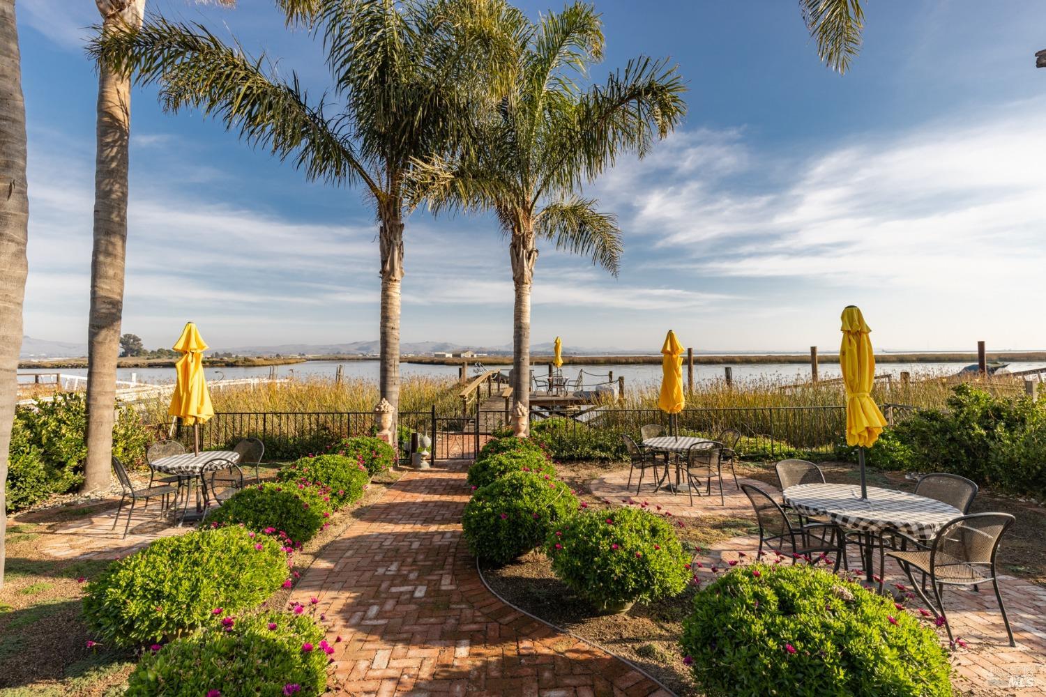 1730 Milton Road Napa, CA 94559 - Photo 34 of 77 a view of a lake with a table and chairs