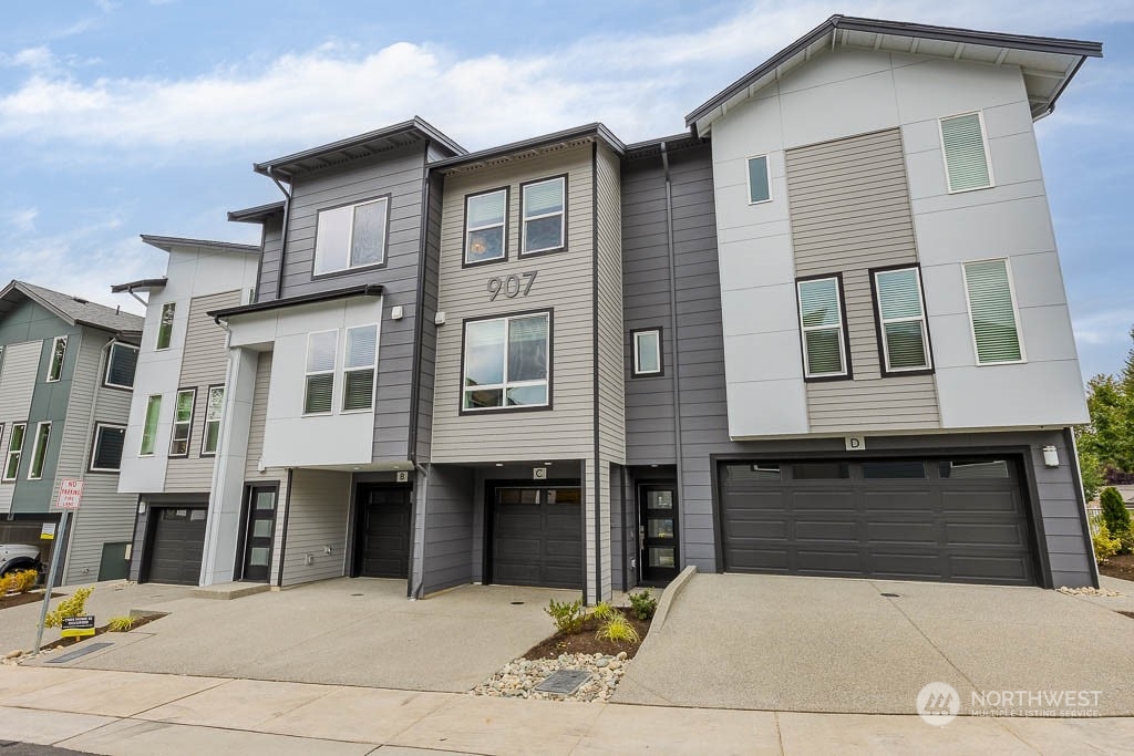 23833 9th Avenue Southeast, Unit B 19 Bothell, WA 98021 - Photo 1 of 32 a front view of a building with many windows