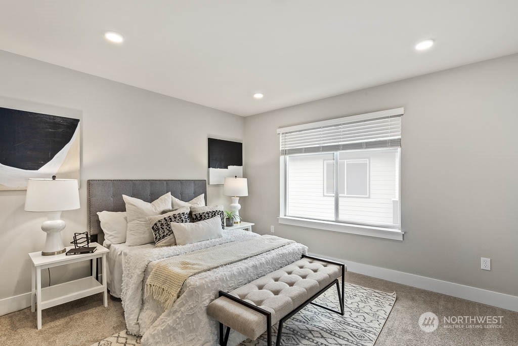 23833 9th Avenue Southeast, Unit B 19 Bothell, WA 98021 - Photo 20 of 32 a bedroom with a bed and wooden floor