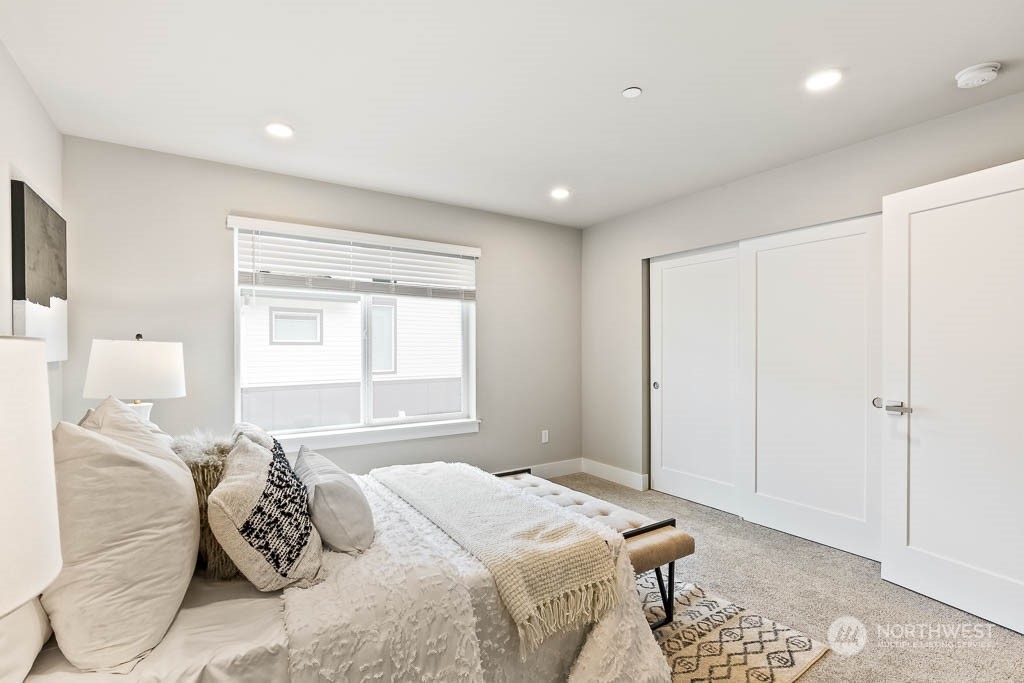 23833 9th Avenue Southeast, Unit B 19 Bothell, WA 98021 - Photo 23 of 32 a bedroom with a bed and a window