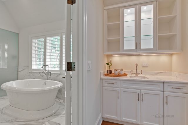 a bathroom with a sink and a bathtub