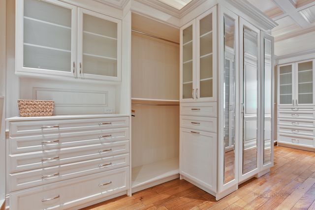 a view of closet area with empty racks