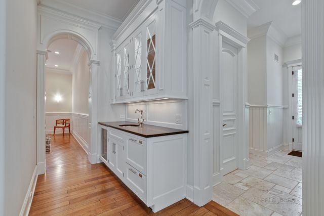 a kitchen with granite countertop a sink and a stove top oven
