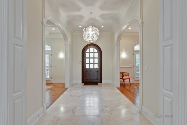 a view of a hallway with a chandelier