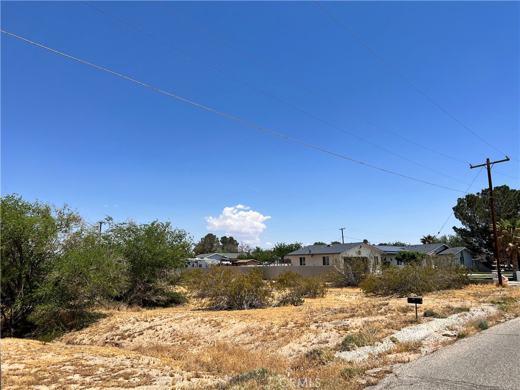 0 Condor Road Victorville, CA 92394 - Photo 1 of 1 a view of a lake with a house in the background