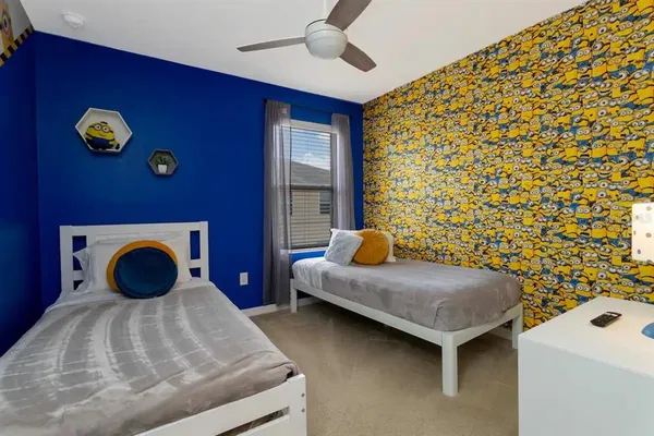 a bedroom with a bed and a chandelier