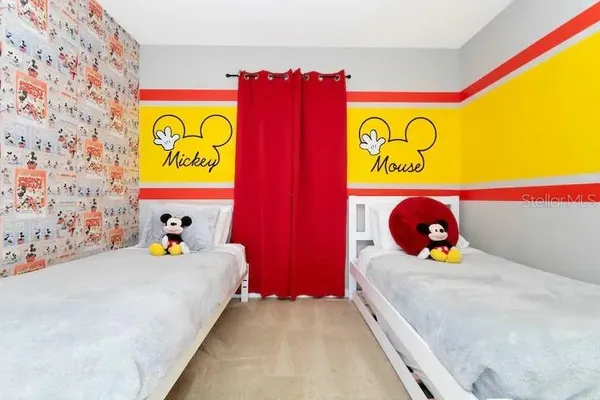 a bedroom with a bed and dresser
