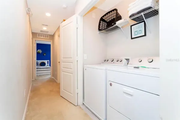 a bathroom with a sink mirror and toilet