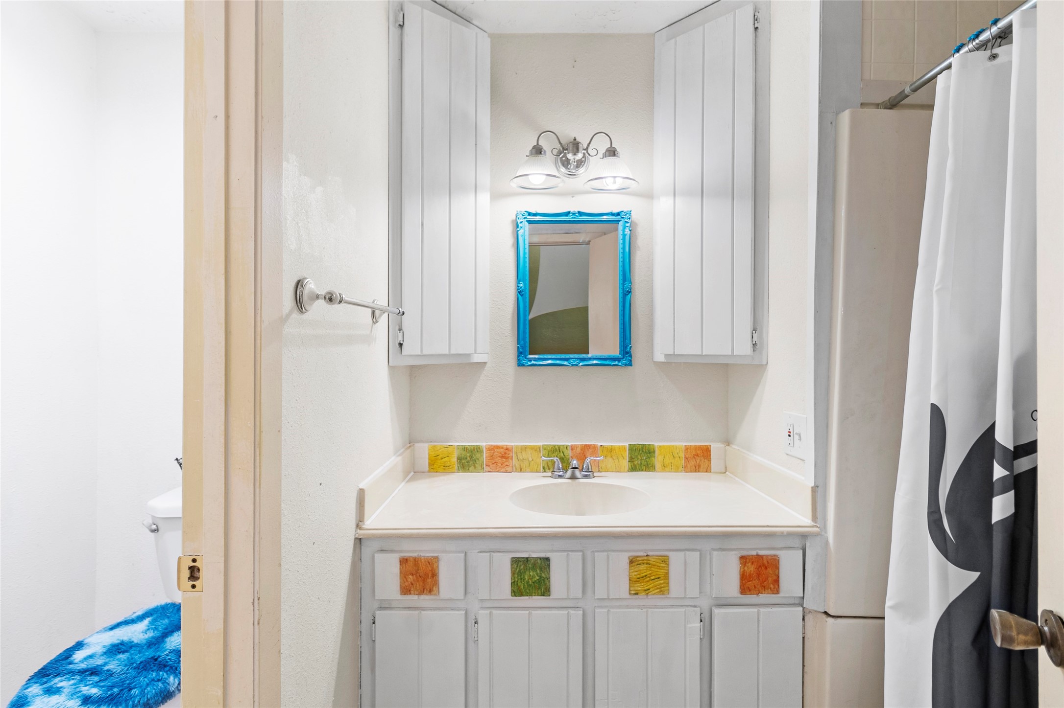 38 Darrell White Road Huntsville, TX 77340 - Photo 26 of 49 a bathroom with a sink and a mirror