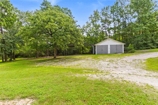 a big house with lots of green space