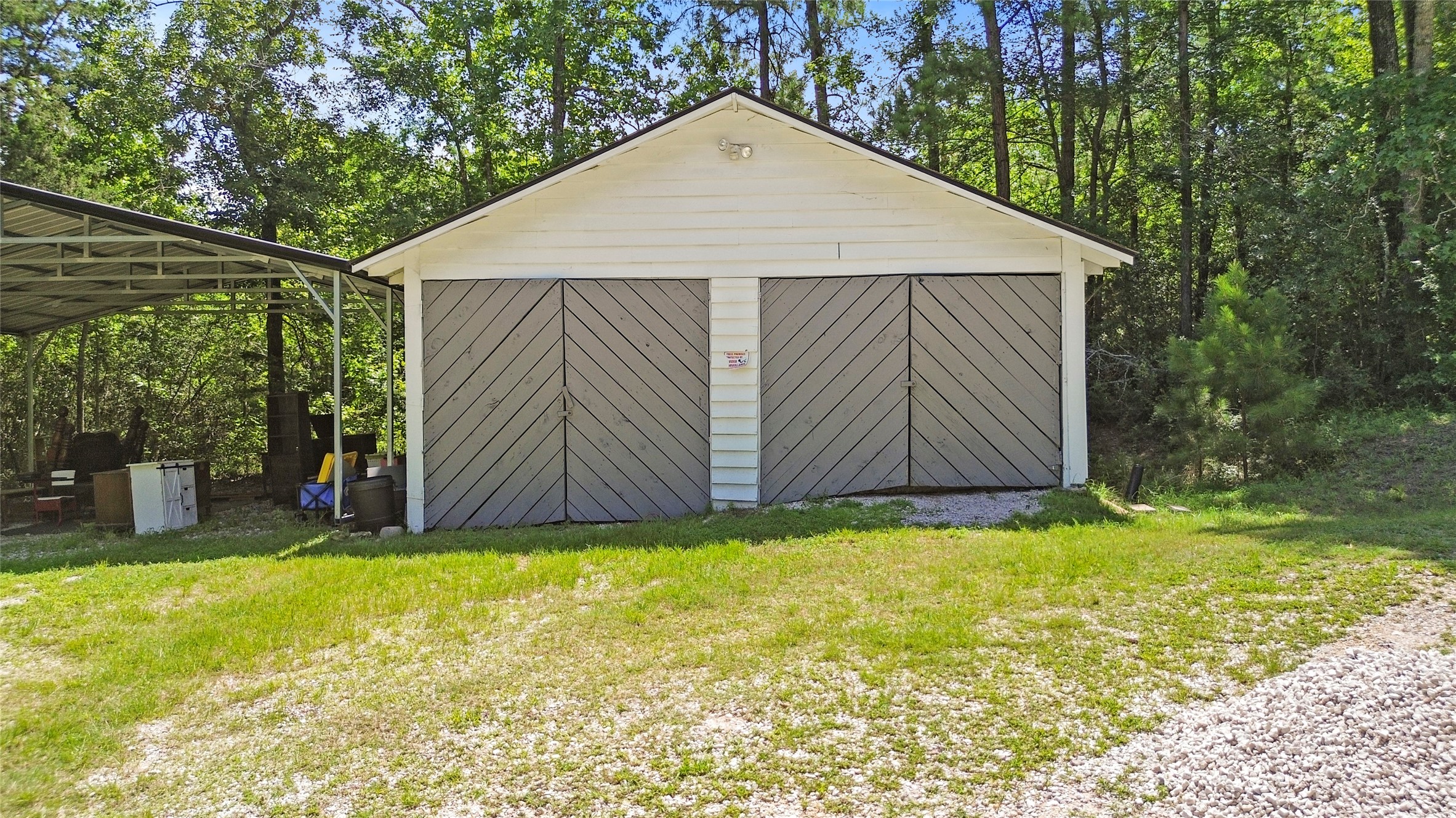38 Darrell White Road Huntsville, TX 77340 - Photo 34 of 49 a view of a small house with a yard