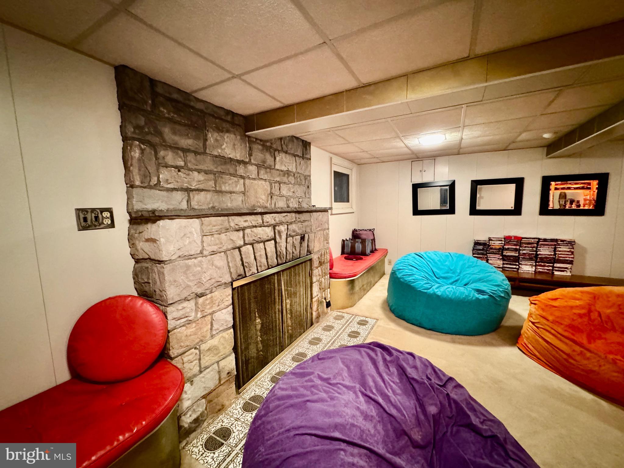 2251 Moore Street Huntingdon, PA 16652 - Photo 90 of 106 basement tv room with retro bar and stone fire pla