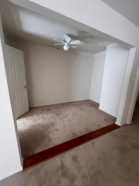 6304 South Rice Avenue Bellaire, TX 77401 - Photo 13 of 16 an empty room with a ceiling fan and window
