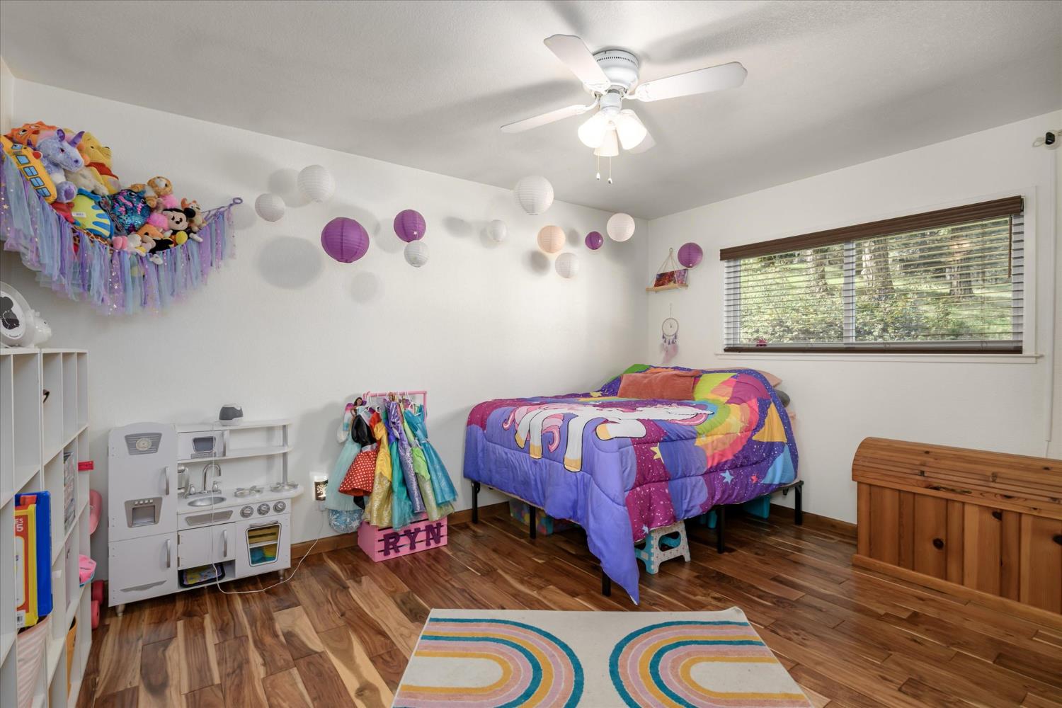 3640 Omo Ranch Road Somerset, CA 95684 - Photo 22 of 57 a bedroom with furniture and a wooden floor