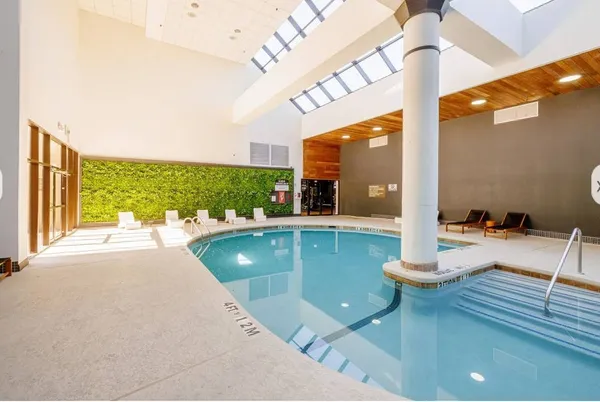 a living room with furniture and a swimming pool
