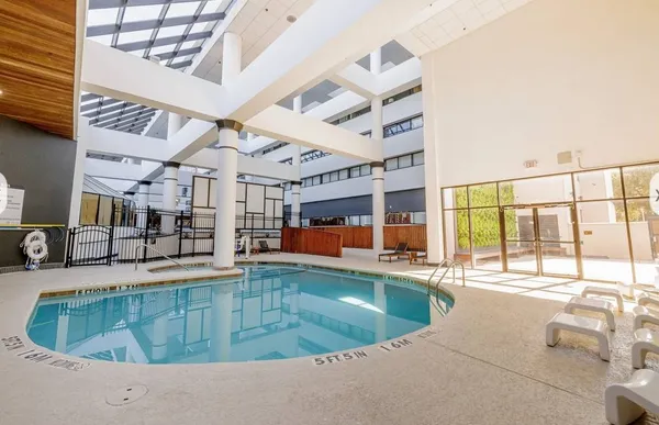 a view of a swimming pool with a lounge chairs