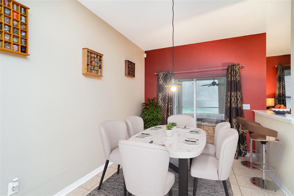 10903 Wildcat Drive Riverview, FL 33579 - Photo 16 of 45 a view of a dining room with furniture and wooden floor