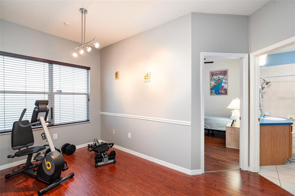 10903 Wildcat Drive Riverview, FL 33579 - Photo 17 of 45 a view of a workspace with wooden floor and a window
