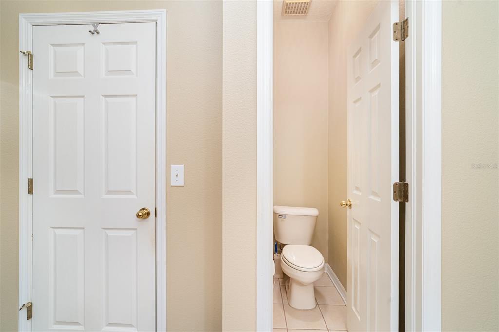 10903 Wildcat Drive Riverview, FL 33579 - Photo 18 of 45 a bathroom with a toilet