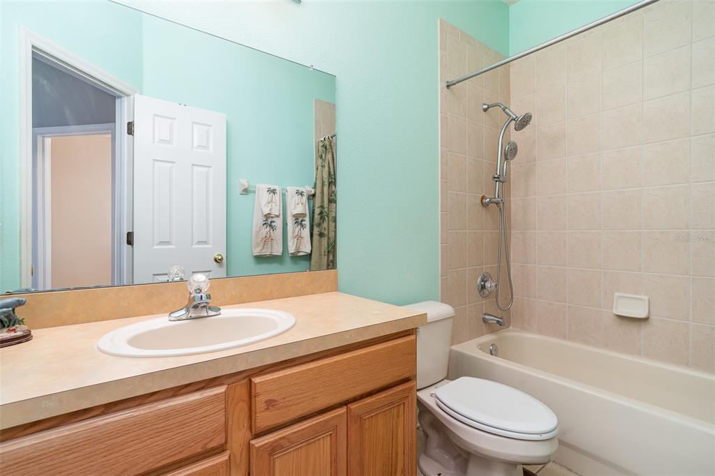 10903 Wildcat Drive Riverview, FL 33579 - Photo 21 of 45 a bathroom with a sink toilet tub and shower