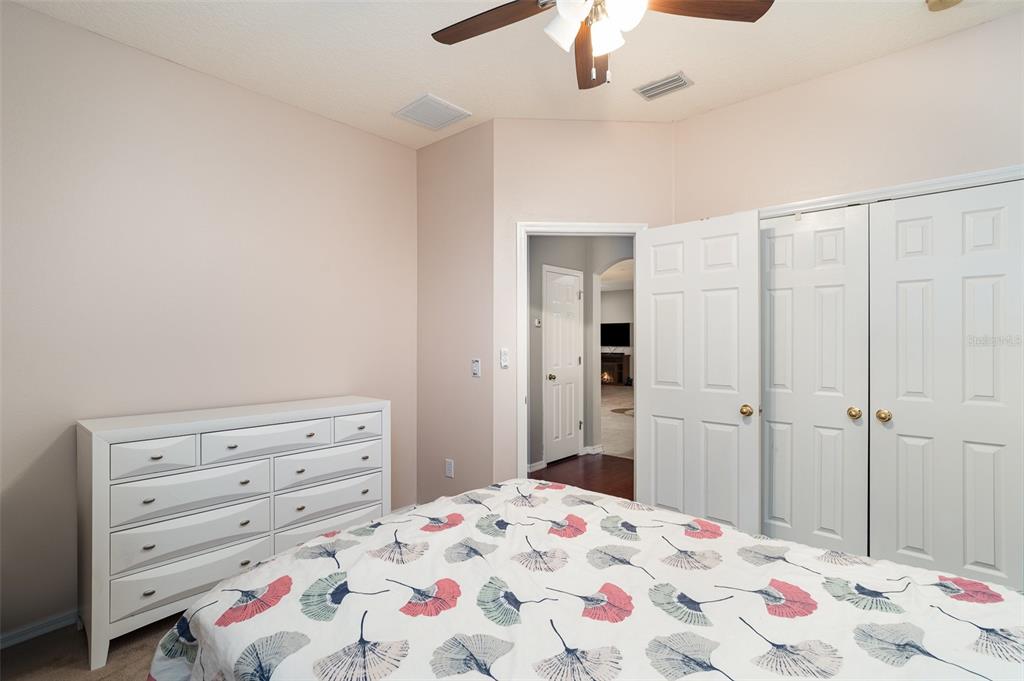 10903 Wildcat Drive Riverview, FL 33579 - Photo 23 of 45 a bedroom with a bed and a dresser