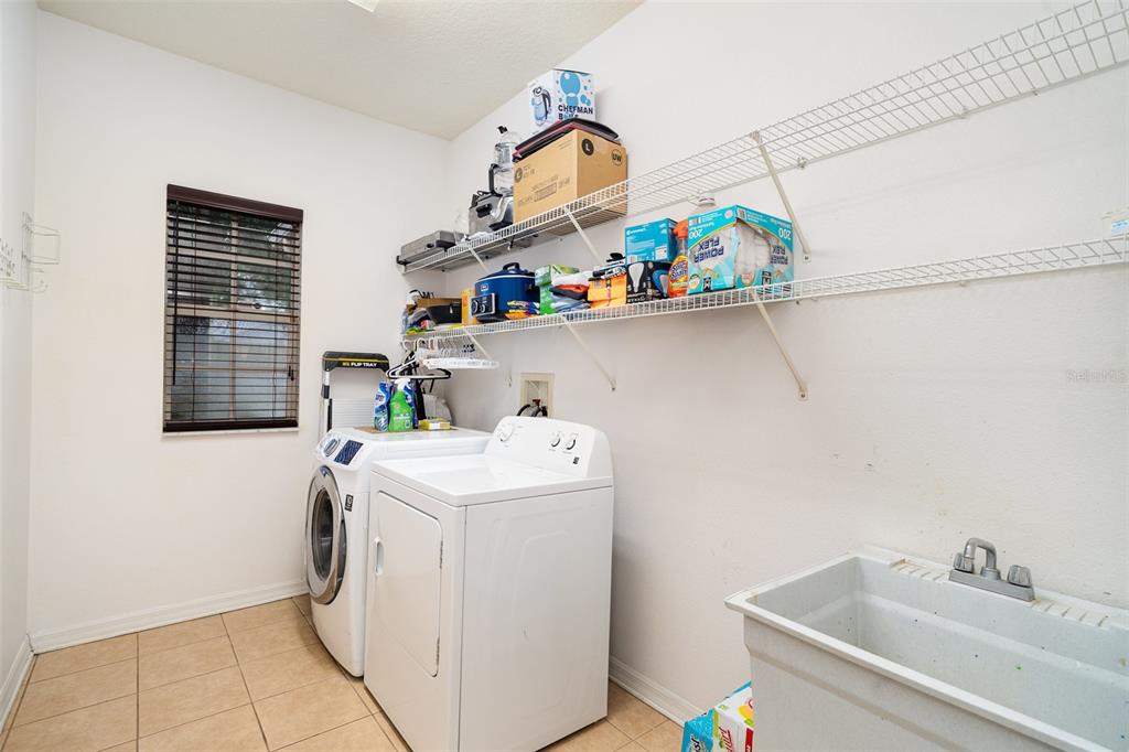 10903 Wildcat Drive Riverview, FL 33579 - Photo 24 of 45 a utility room with dryer and washer