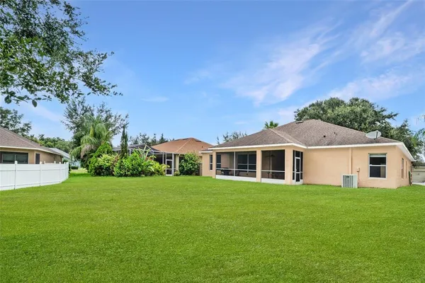 a view of house with outdoor space and tree s