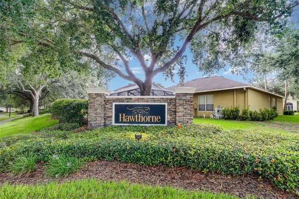 a view of a white building with many windows