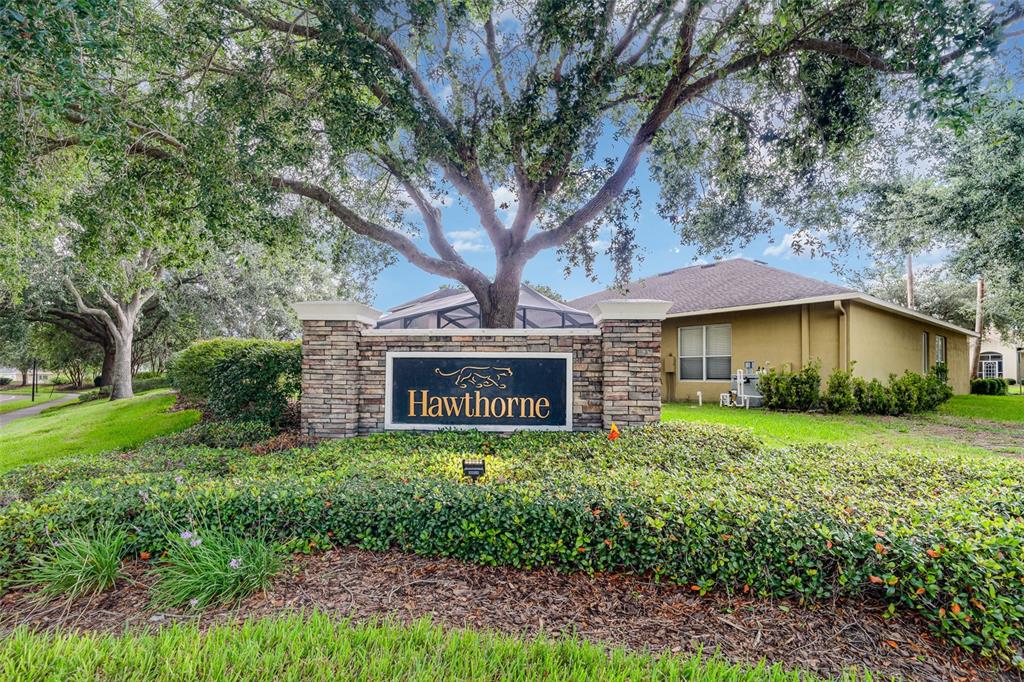 10903 Wildcat Drive Riverview, FL 33579 - Photo 31 of 45 a sign of golf club on a wall under a large tree