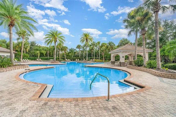 a view of a swimming pool with lounge chair