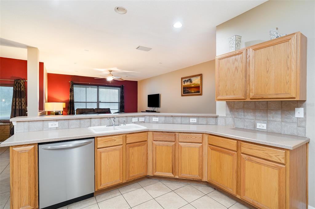 10903 Wildcat Drive Riverview, FL 33579 - Photo 8 of 45 a kitchen with sink cabinets and window