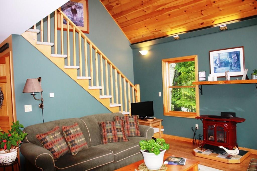 558 Rockwood Road Greenville Junction, ME 04442 - Photo 16 of 31 First floor living and staircase to...