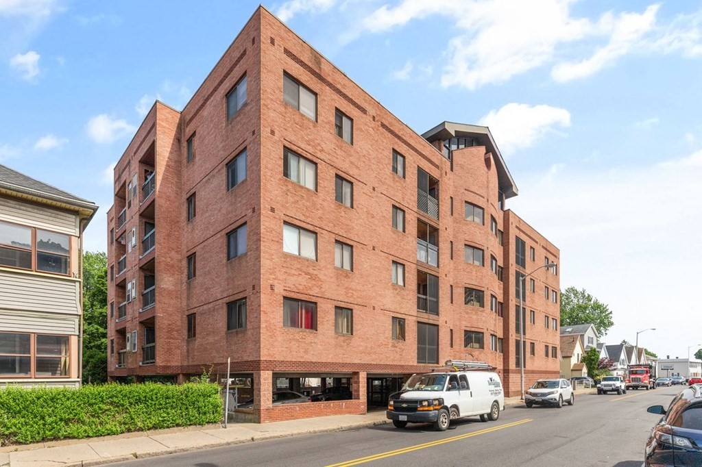 205 Ferry Street, Unit 409 Everett, MA 02149 - Photo 2 of 24 a car parked in front of a building