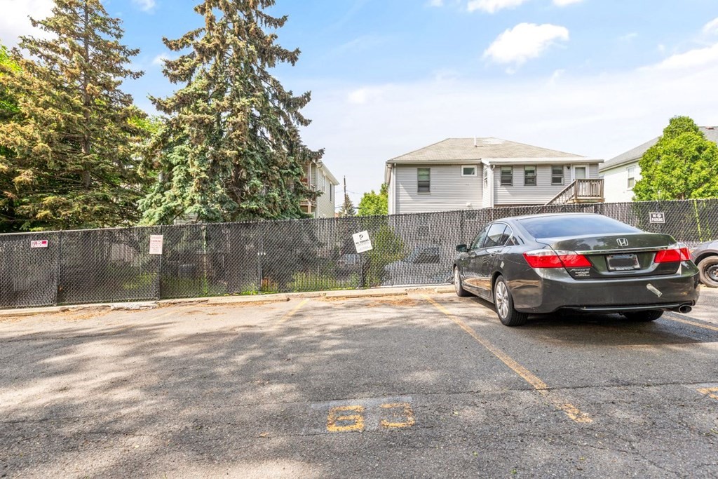 205 Ferry Street, Unit 409 Everett, MA 02149 - Photo 24 of 24 a car parked in front of a house