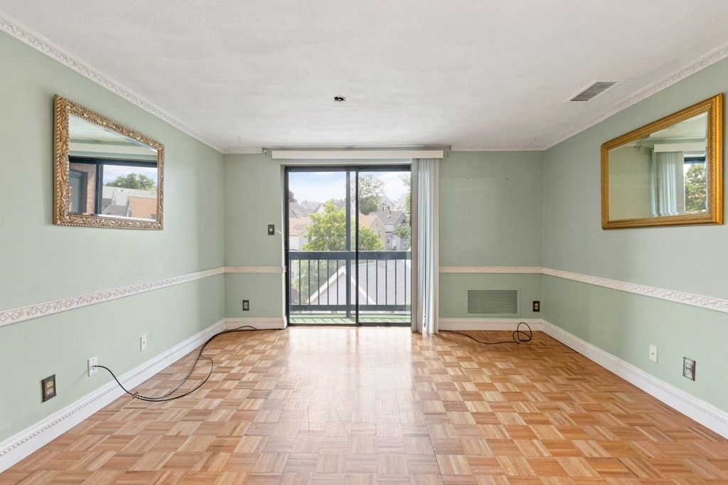 205 Ferry Street, Unit 409 Everett, MA 02149 - Photo 7 of 24 a view of an empty room with a window