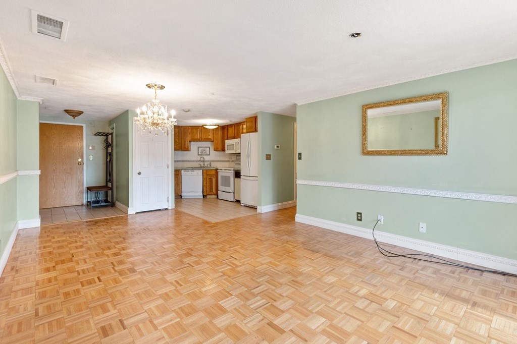 205 Ferry Street, Unit 409 Everett, MA 02149 - Photo 9 of 24 a view of a kitchen with a sink and cabinets