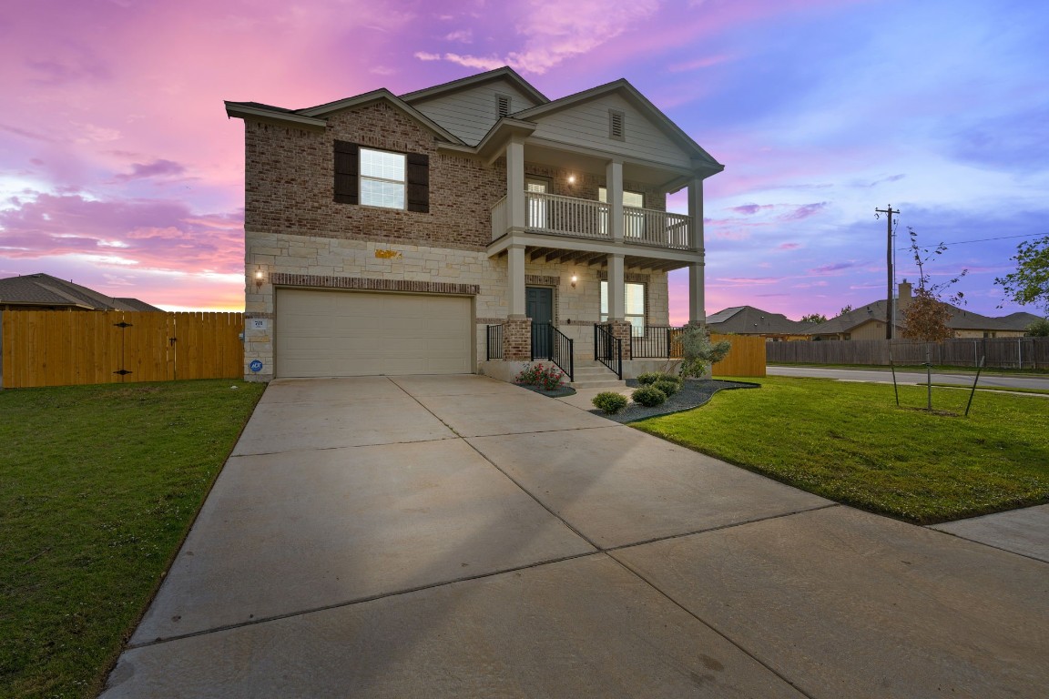 701 Coltrane Drive Pflugerville, TX 78660 - Photo 1 of 1 a front view of a house with a yard